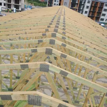 Prefabricated trusses installed on a multi-family building