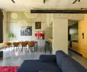 The lowest floor of the house, interior; view of the living area, with kitchen, dining room, living room and conservatory (out of frame) 