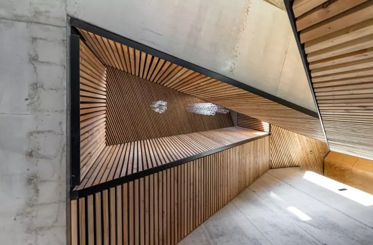 all levels of the house are connected by a staircase that starts at the conservatory, then turns into a ramp and again into a staircase
