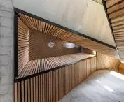 all levels of the house are connected by a staircase that starts at the conservatory, then turns into a ramp and again into a staircase