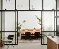 industrial glazing allows acoustic division of space while maintaining the wandering of light and a wider perspective for the eye