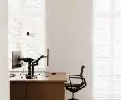 large desks are made to individual design, and ergonomic, airy armchairs provide high comfort at work