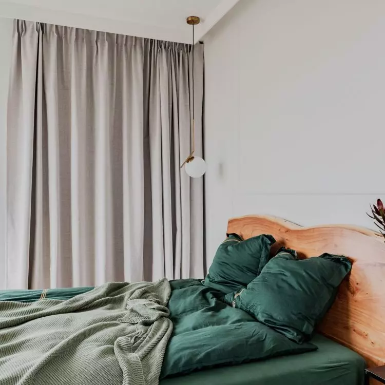 The bedroom has electrically operated curtains
