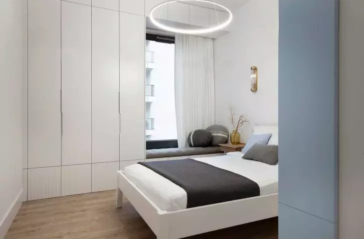 The bedroom is maintained in marine colors