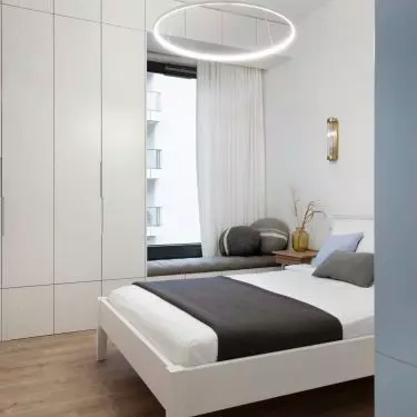 The bedroom is maintained in marine colors