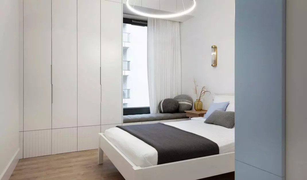 The bedroom is maintained in marine colors