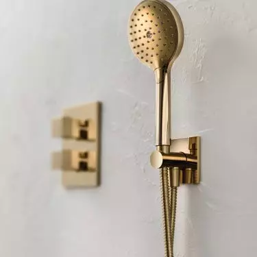 Set with shower handset in gold color