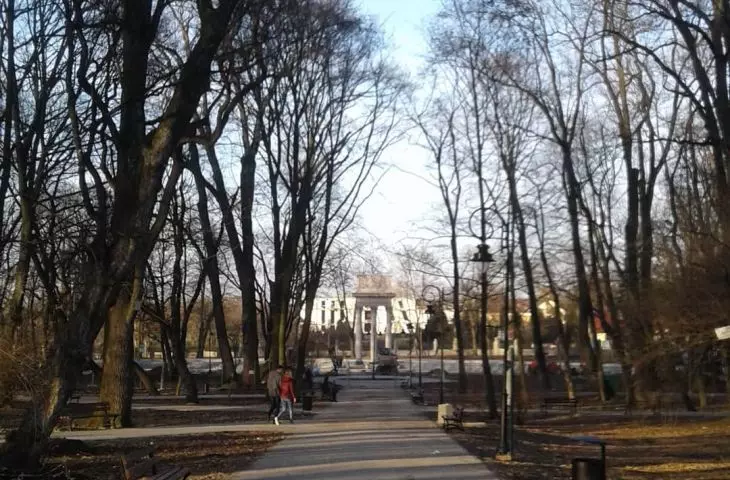 A path among tall trees that leads to the mausoleum of Joseph Bem