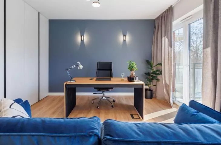 Cabinet with a navy blue wall 