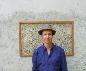 Pawel Fornalski on the background of hemp concrete