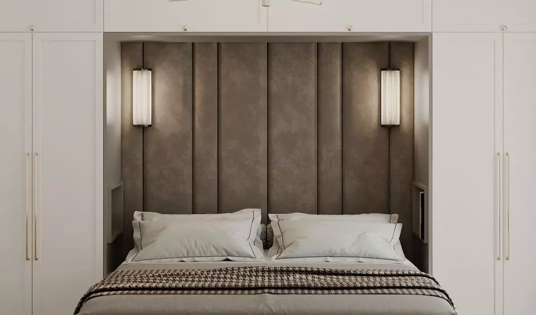 In the center of the bedroom is an upholstered bed 