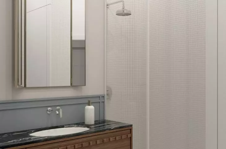 In the bathroom, wood combines with stone and gold