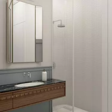 In the bathroom, wood combines with stone and gold