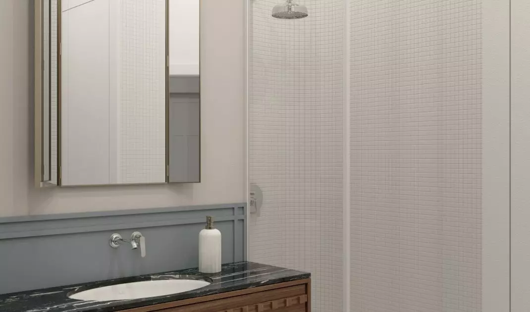 In the bathroom, wood combines with stone and gold