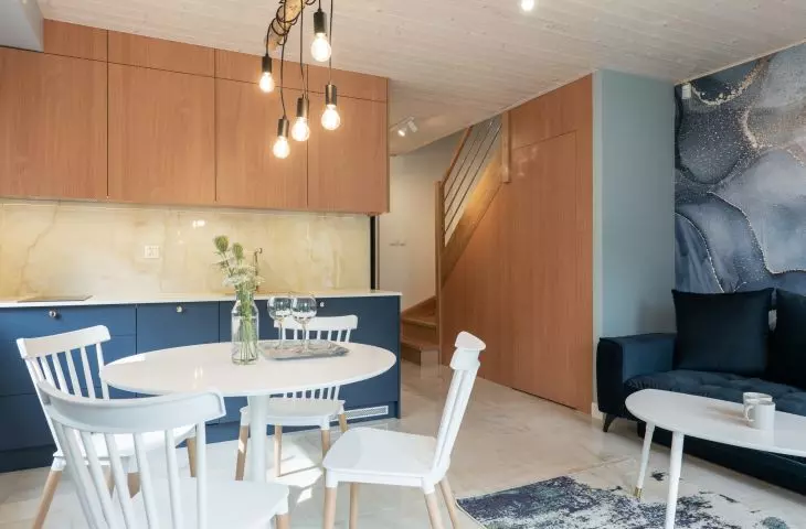 The interior is dominated by the combination of navy blue with white and wood