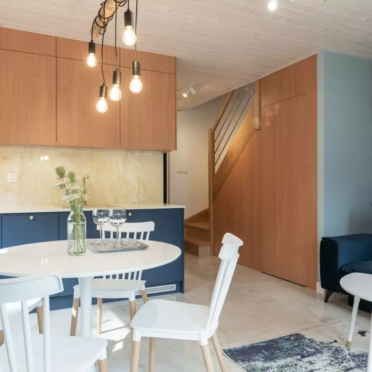 The interior is dominated by the combination of navy blue with white and wood