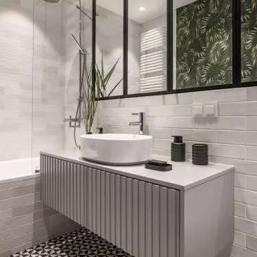 The dominant color in the bathroom is gray