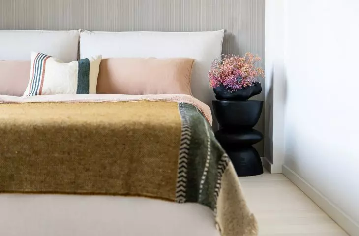 Bedroom with striped wallpaper