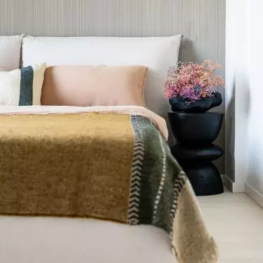 Bedroom with striped wallpaper