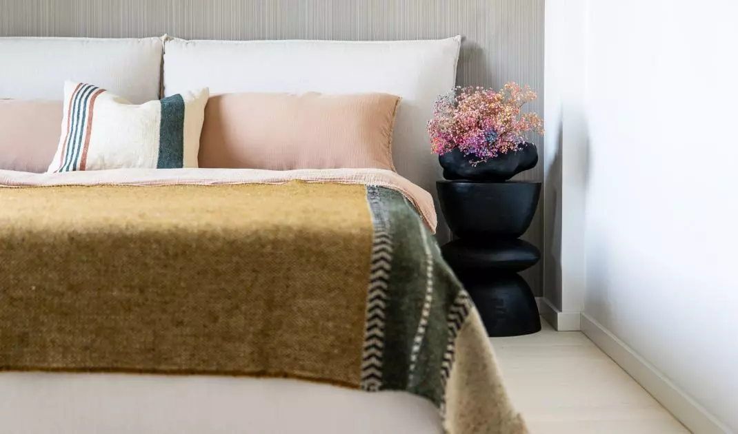 Bedroom with striped wallpaper