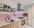 In the kitchen, the architect used pink tiles on the wall