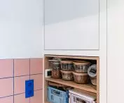 The cabinet in the kitchen was created after moving the toilet wall 
