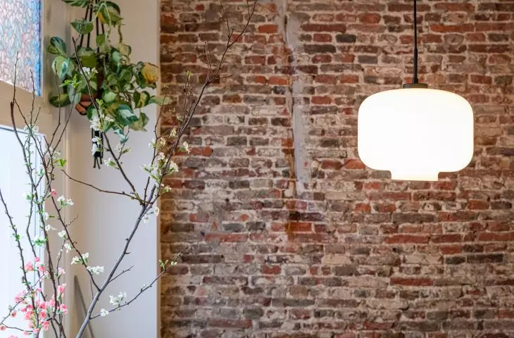 The architect decided to leave the brick wall in place