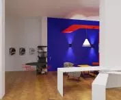 The walls in the cafe are white, the exceptions being one in indigo and one with stylized graphics