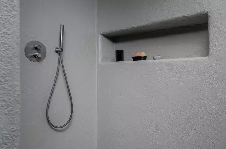 The bathroom is sunk in gray