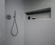 The bathroom is sunk in gray