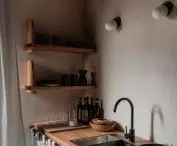 wooden furniture for the kitchen was designed by the architects from the studio Loft Kolasinski