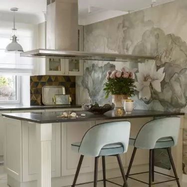 The kitchenette stands out with wallpaper 