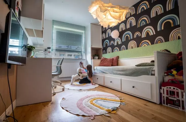 A rainbow motif appears in the girls' room
