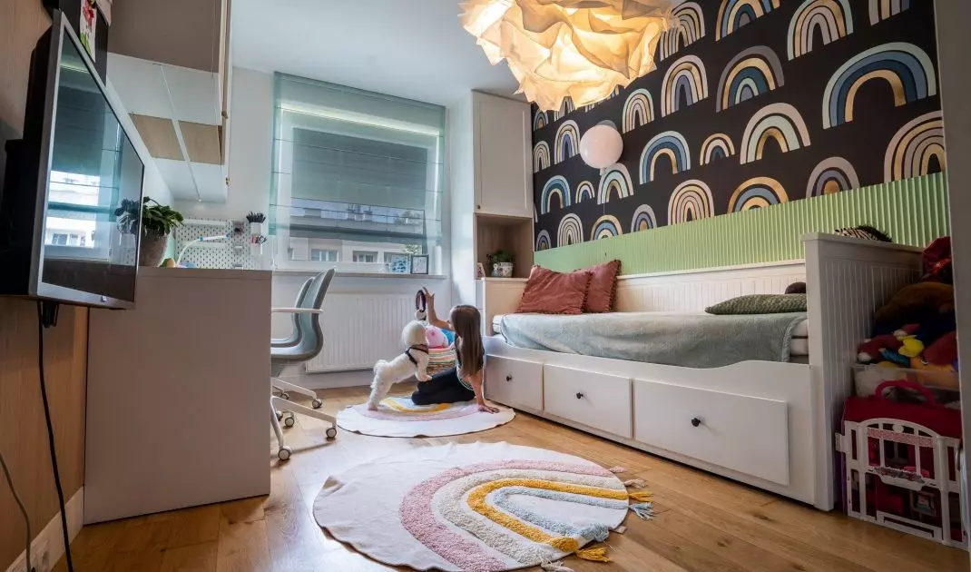 A rainbow motif appears in the girls' room