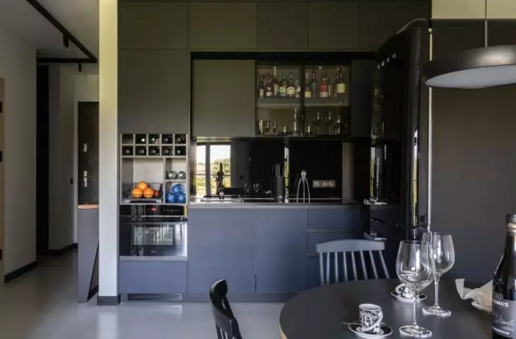 The kitchen connects to the living room