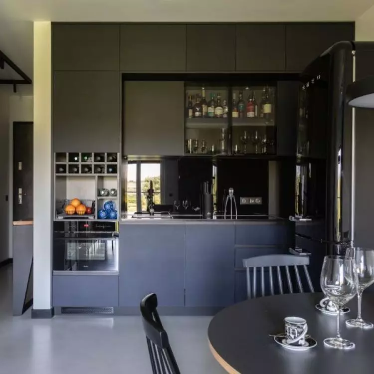 The kitchen connects to the living room