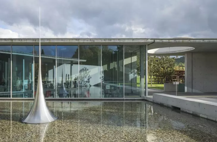  The shallow pond surrounding the pavilion is the site of the display of the sculpture 