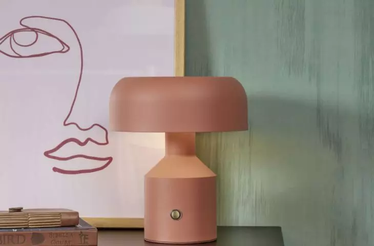 A colorful bedside lamp will liven up the arrangement 