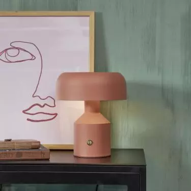 A colorful bedside lamp will liven up the arrangement 