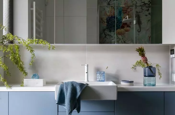 The bathroom is used by three boys