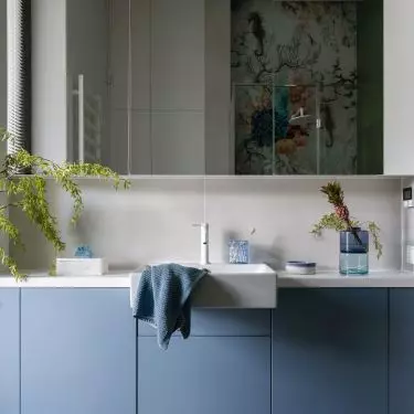 The bathroom is used by three boys