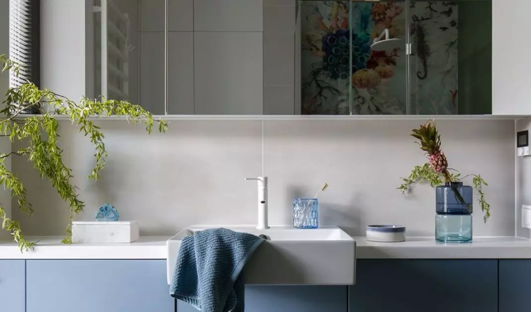 The bathroom is used by three boys