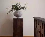 The ceramic vase was made by Marcin Kuberná