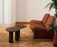 A table with a marble edged top in the reception area