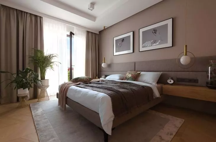 The bedroom wall was lined with upholstered panels 