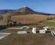 concrete towers protruding above the surface of the terrain are meant to be a reference to the limestone spurs emerging in places in the surrounding fields and vineyards 