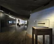 in such an ascetic interior, illuminated display cases with exhibits catch the eye