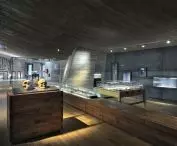 in such an ascetic interior, illuminated display cases with exhibits catch the eye