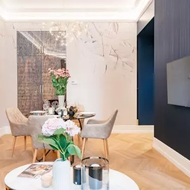 Navy blue wall contrasts with large-format graphics 