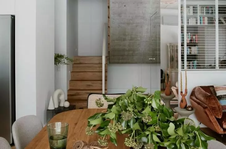 Interior combines raw finishes with warm woods